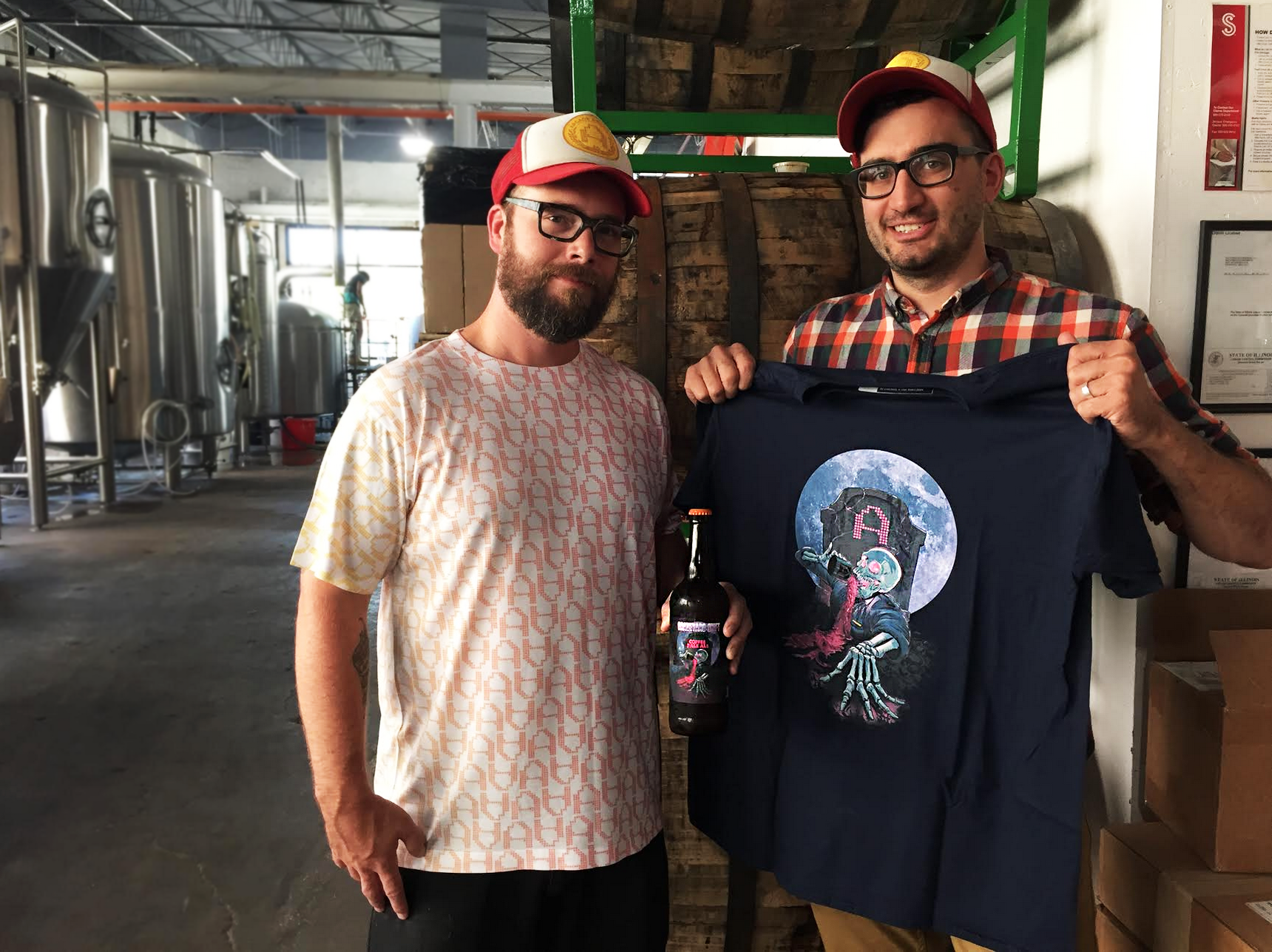 Lance Curran (left) and Chris (LASTNAME) (right) holding their Graveyard Shift beer and tee